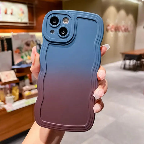 a person holding a phone case in their hand