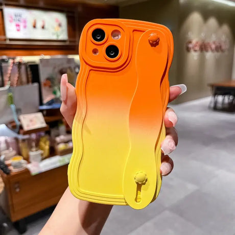 a person holding a phone case in their hand