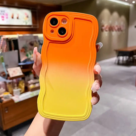 a person holding a phone case in their hand