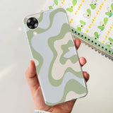 a person holding a phone case with a camouflage pattern