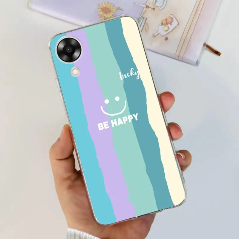 a person holding a phone case with the words be happy