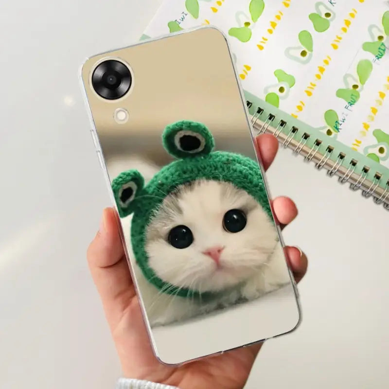 a person holding a phone case with a cat in it