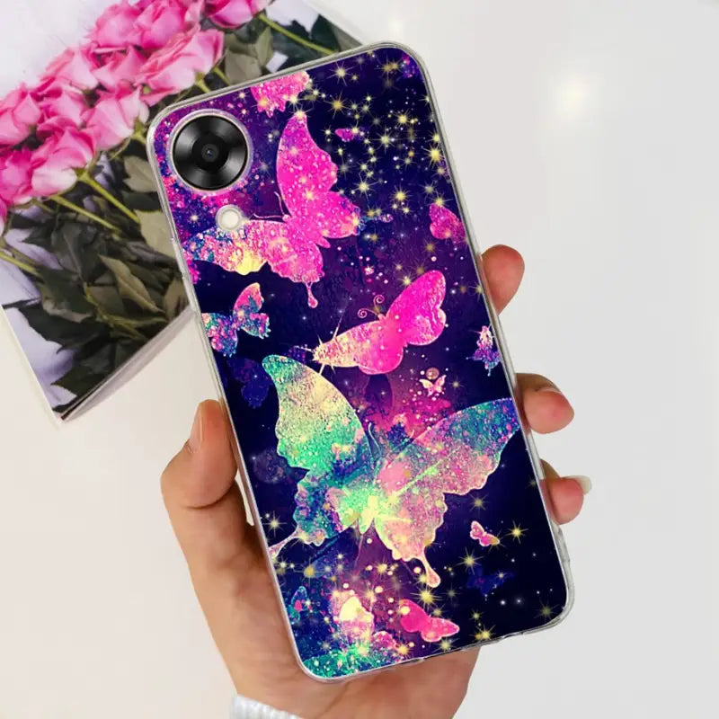 a person holding a phone case with a colorful butterfly design