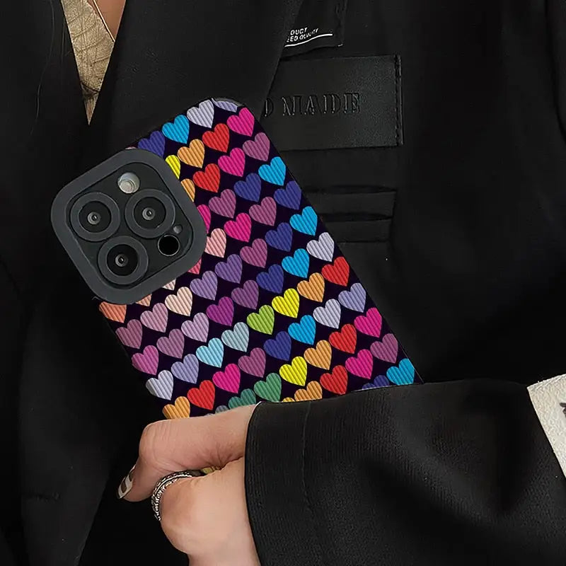 a man in a suit holding a phone case