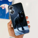 a person holding a phone case with a wolf on it