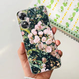 a person holding a phone case with flowers on it