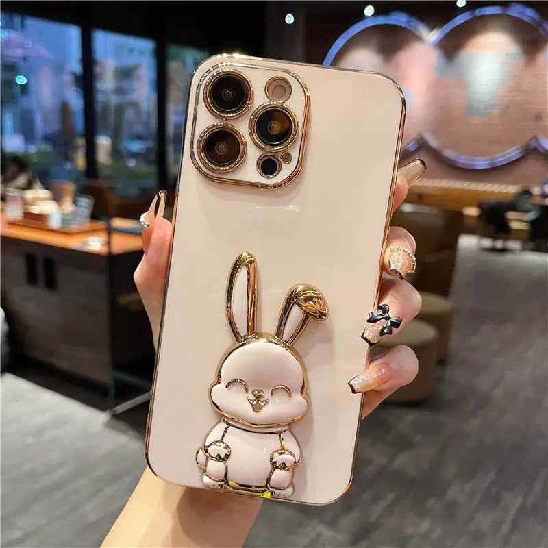 a person holding a phone case with a rabbit on it