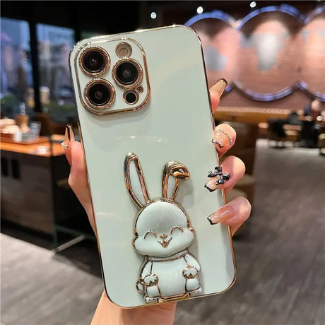 a person holding a phone case with a rabbit on it