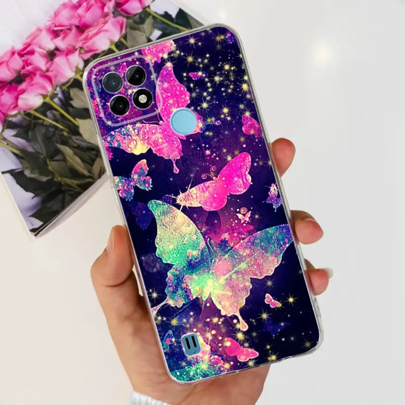 a person holding a phone case with a colorful unicorn