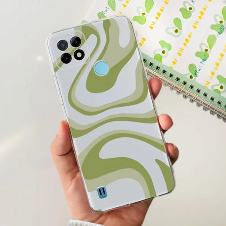 a person holding a phone with a green and white pattern