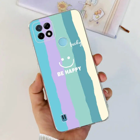 a person holding a phone case with a smiley face on it