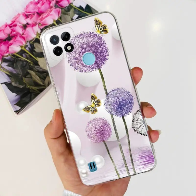 a person holding a phone case with flowers