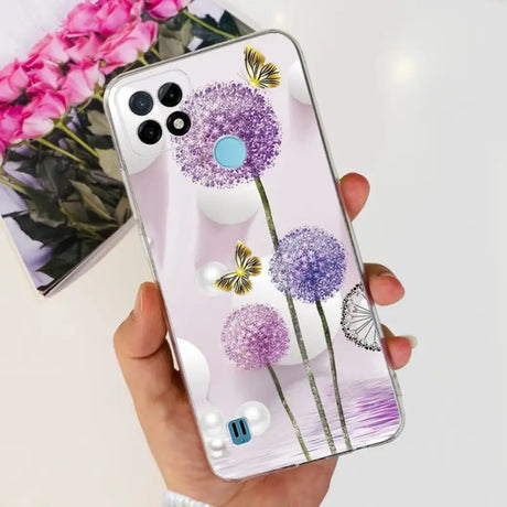 a person holding a phone case with flowers