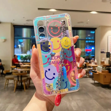 a person holding up a phone case with a colorful pattern