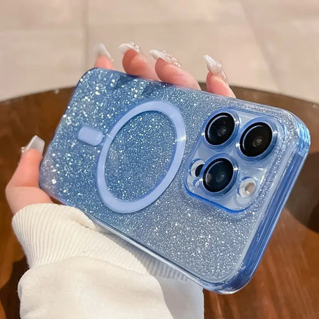 a woman holding a blue glitter phone case