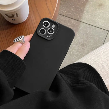 a person holding a phone case with a camera