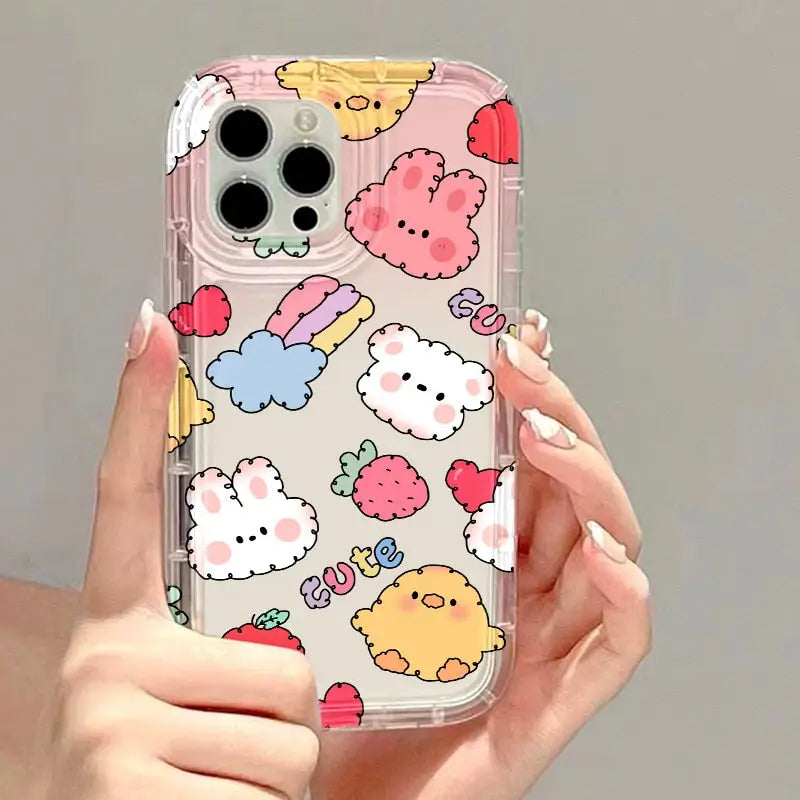 a woman holding a phone case with a bunch of cute animals