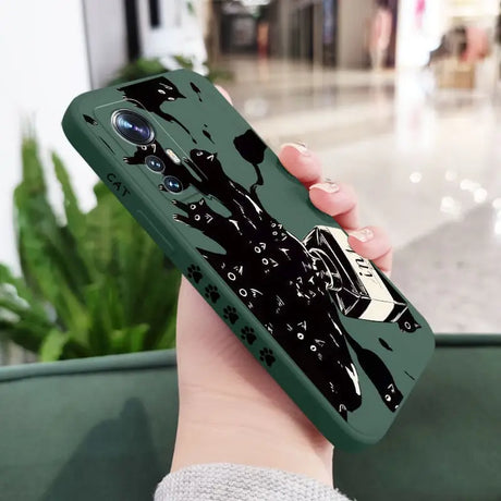 a person holding a phone case with a black and white drawing on it