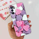 a person holding a phone with pink and white hearts