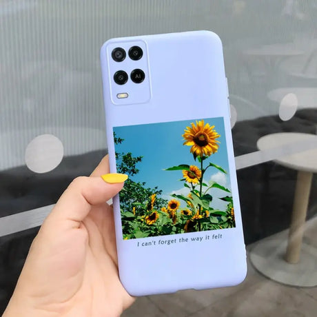 a person holding a phone case with a sunflower on it