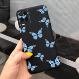 a hand holding a phone case with blue butterflies on it