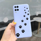 a person holding a phone case with paw prints