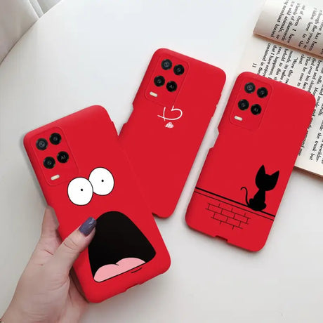 a person holding a red phone case with a cartoon face