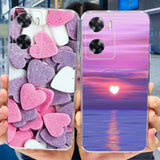 a person holding up a phone case with hearts