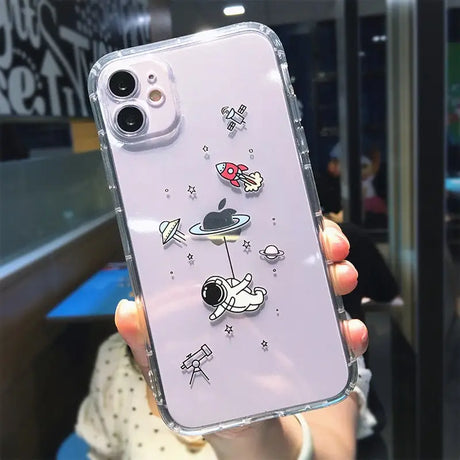 a woman holding a phone case with a cartoon character on it