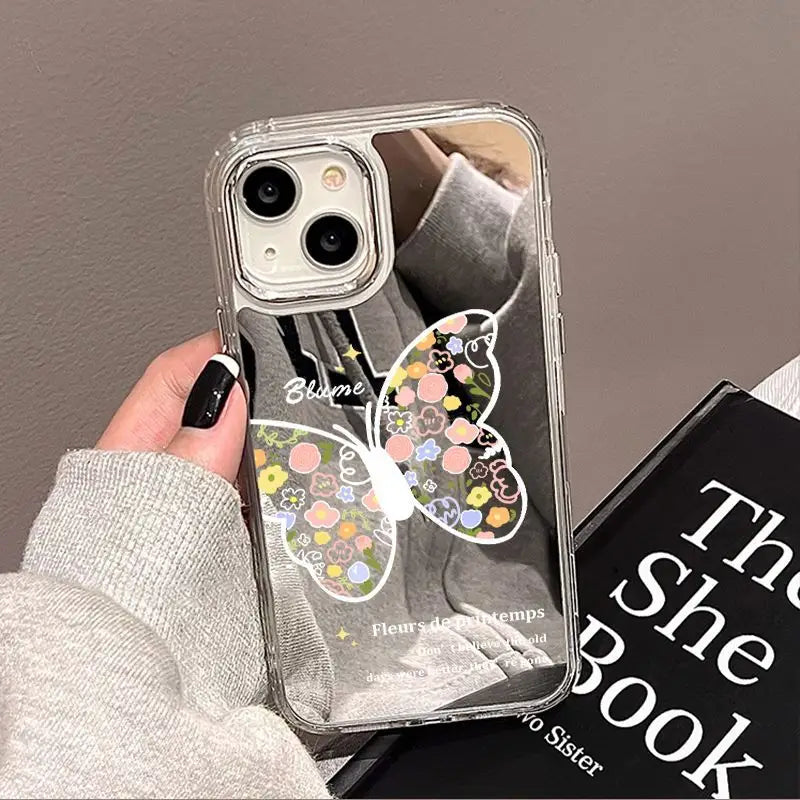 a person holding a phone case with a butterfly design