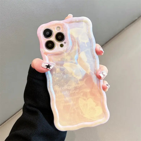 a woman holding a phone case with a pink marble pattern