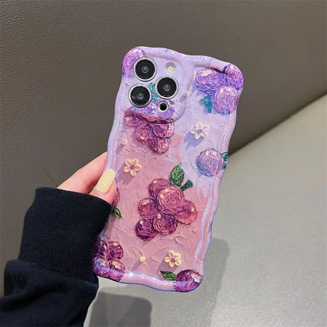 a person holding a phone case with flowers on it