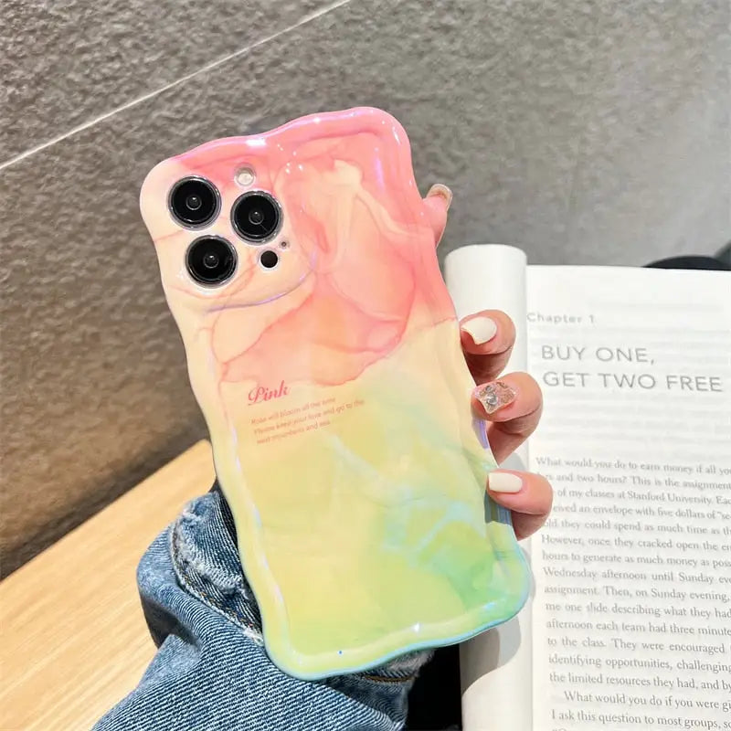 a person holding a phone case with a colorful design