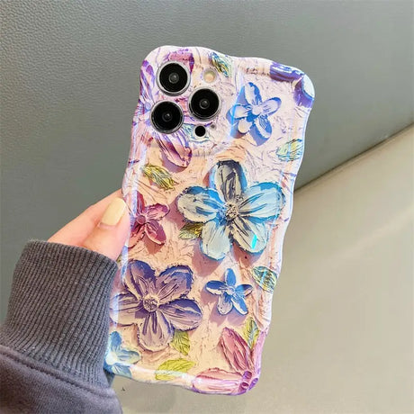 a person holding a phone case with a flower pattern