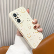 a woman holding a phone case with a smiley face on it