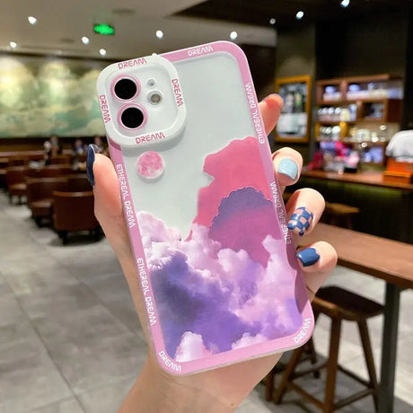 a person holding a phone case with a painting on it