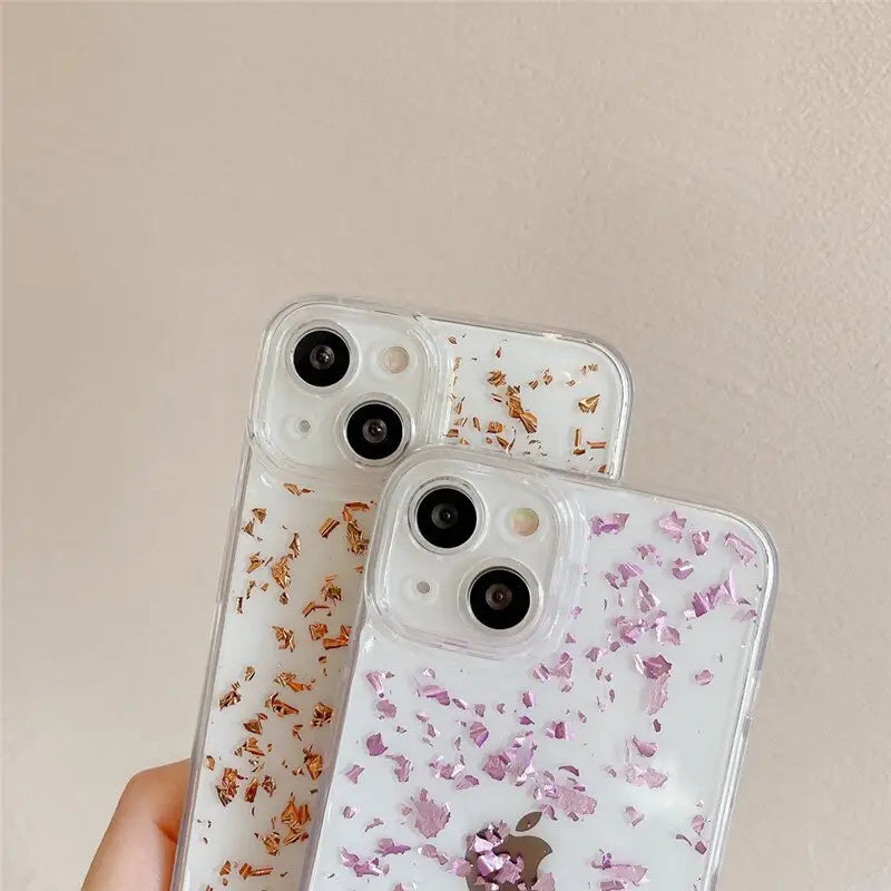 a person holding a phone case with pink flowers on it