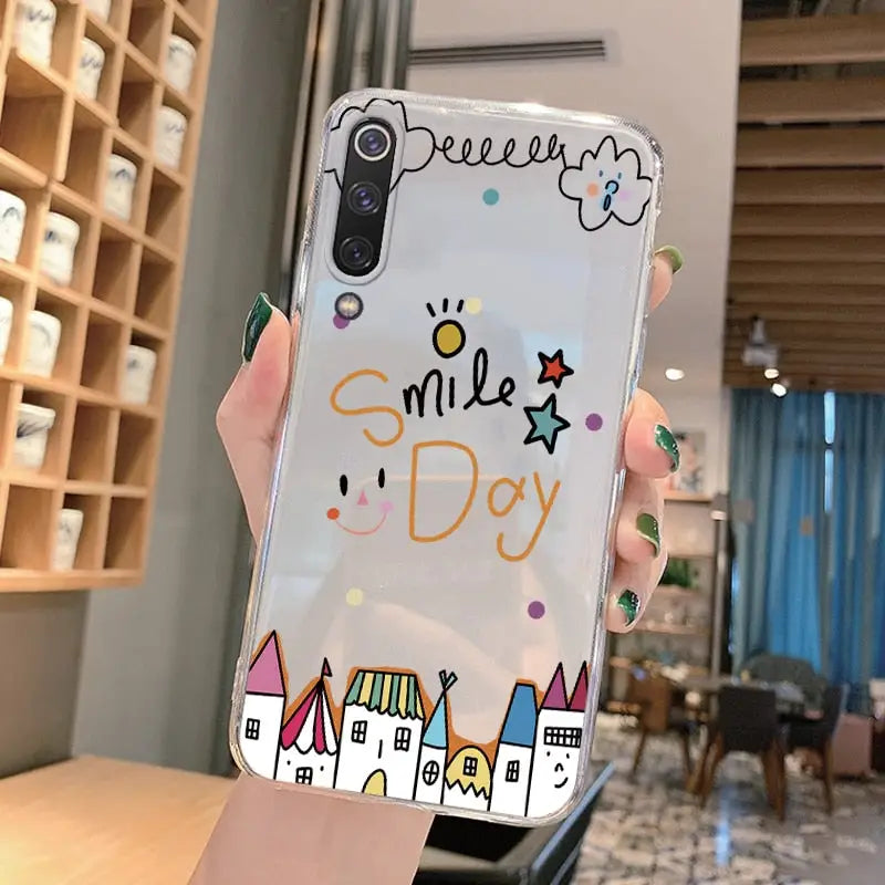 a person holding up a phone case with a drawing of a castle