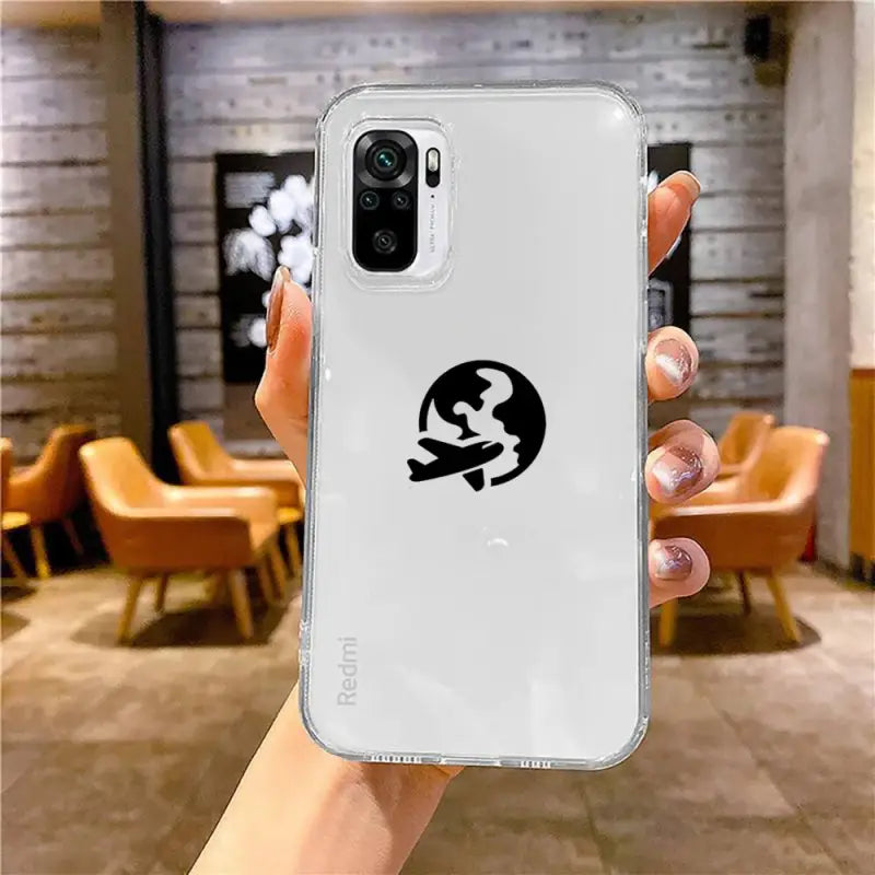 a hand holding a white iphone case with a black logo