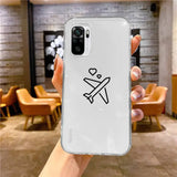 a person holding a phone with a sticker on it