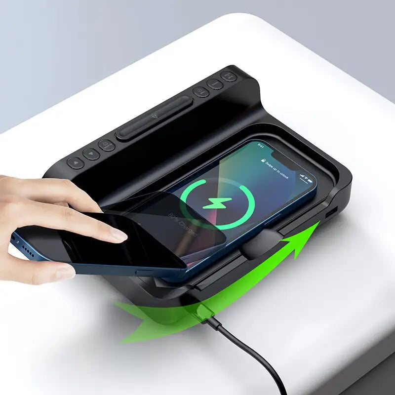a hand holding a phone with a charging station