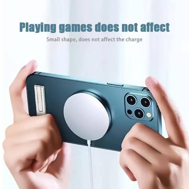 a person holding a phone with a game controller