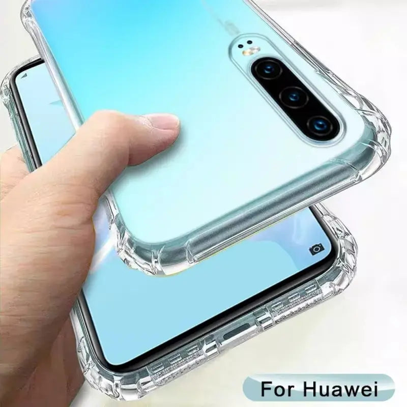 a hand holding a clear case for the iphone