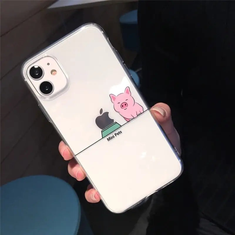 a person holding a phone case with a pig on it