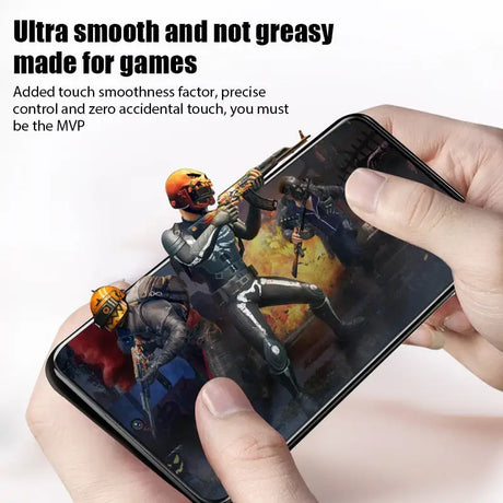 a person holding a phone with a game on it