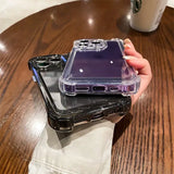 a hand holding a purple phone case