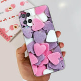 a person holding a phone with pink and white hearts