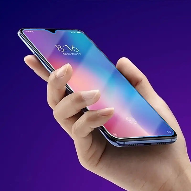 a person holding a phone with a purple background
