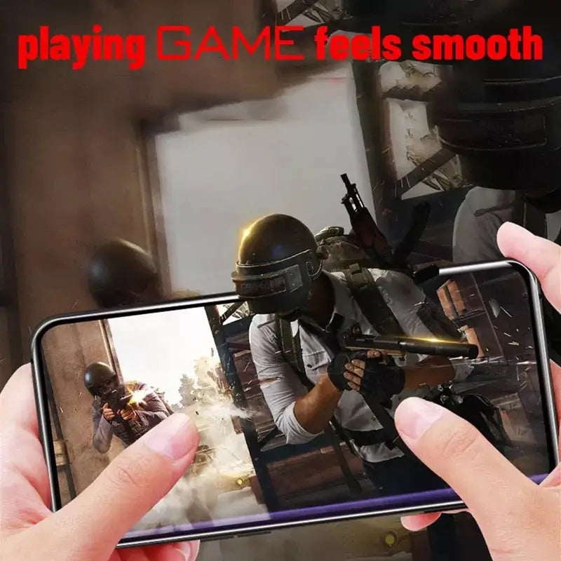 a person holding a phone with a video game on it