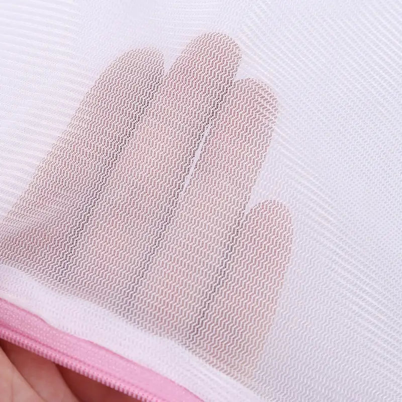 a person is applying a pink fabric on a white background